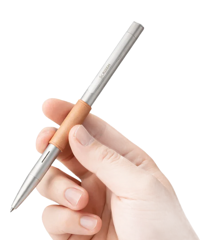 The Scriben AI Pen held in use.